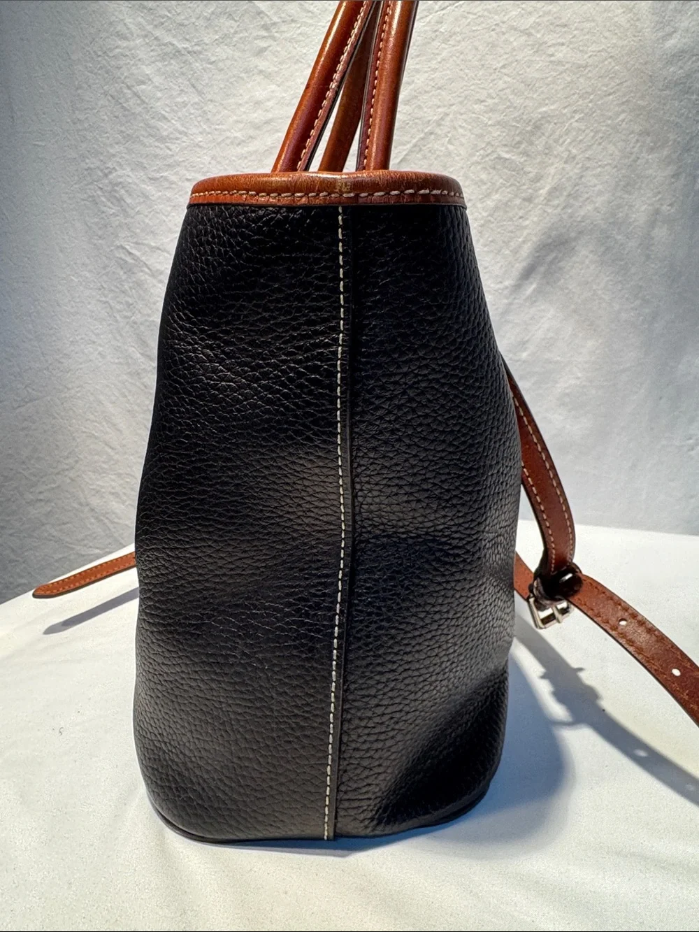 Dooney & Bourke Black Pebbled Leather Tote with Brown Trim & Handles